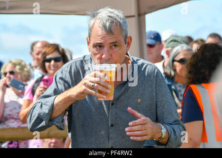 Beaminster, Dorset, UK.  19th August 2018. UK Weather.  Actor Neil Morrissey with a pint of lager at Buckham Fair at Beaminster, Dorset.  Picture Credit: Graham Hunt/Alamy Live News Stock Photo