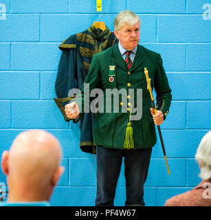 Haddington, UK. 19 August 2018.  The Royal Company of Archers, a ceremonial unit in Scotland, stages a clout archery shoot as part of Haddington 700 events taking place during 2018 to celebrate the granting of a charter by Robert the Bruce to the town in 1318, confirming Haddington's right to hold a market and collect customs. Children also had a chance to try archery. Lt Col Richard Callander OBE TD FRICS DL, secretary of the Company, gives a talk about the company and shows his ceremonial sword Stock Photo