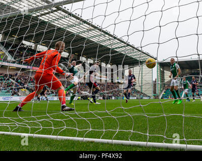 Easter Road, Edinburgh, UK. 19th Aug, 2018. Scottish League Cup second round, Hibernian versus Ross County; David Gray of Hibernian scores his equaliser past keeper Fox in for 1-1 in the 15th minute Credit: Action Plus Sports/Alamy Live News Stock Photo
