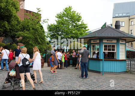 COLOGNE, GERMANY - MAY 31, 2018: people eating street food from kiosk in Cologne, Germany Stock Photo