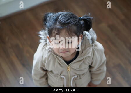 baby girl with sad face Stock Photo