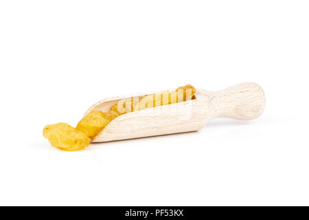 Lot of whole dry golden raisins sultana variety with wooden scoop isolated on white background Stock Photo