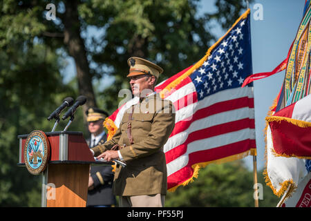 General of the Armies John Pershing re-enactor Chas Rittenhouse reads quotes from Pershing at a wreath-laying ceremony at the gravesite of Pershing in Section 34 of Arlington National Cemetery, Arlington, Virginia, August 10, 2018. The ceremony was hosted by First Army and commemorated its 100th birthday. (U.S. Army photo by Elizabeth Fraser / Arlington National Cemetery / released) Stock Photo