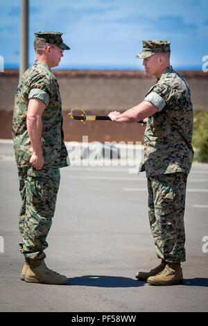 U.S. Marine Corps Sgt. Maj. Bryan L. Marzzarella, right, outgoing battalion sergeant major, 1st Marine Raider Support Battalion (1st MRSB), Marine Corps Forces Special Operations Command (MARSOC), passes the NCO sword to Lt. Col. Bradley Ledbetter, commanding officer, 1st MRSB, MARSOC, during 1st MRSB’s relief and appointment ceremony at Marine Corps Base Camp Pendleton, California, Aug. 14, 2018. This relief and appointment ceremony represented the senior-enlisted Marine giving his duties and responsibilities to the new sergeant major, Sgt. Maj. Jon M. McCloskey. (U.S. Marine Corps photo by L Stock Photo