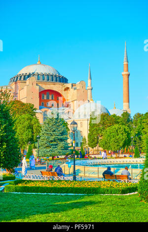Istanbul, Turkey - July 16, 2018: Park with walking people in Sultanahmet square near The Hagia Sophia museum, Turkey Stock Photo