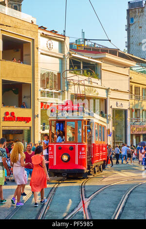 Istanbul, Turkey - July 18, 2018: Historic old tram and walking people in Istiklal pedestrian street in Istanbul Stock Photo