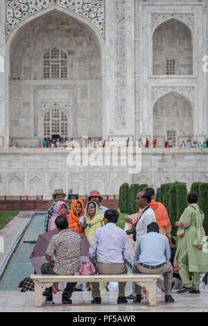 People take selfies on the bench Princess Diana sat on in front of the Taj Mahal. Stock Photo
