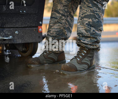 Senior Airman Stephen Runge, 9th Civil Engineer Squadron pavements and heavy equipment technician, drives his feet into the pavement Aug. 10, 2018, at Beale Air Force Base, California. Pavement and heavy equipment Airmen help maintain the roads and flight line for Recce Town USA. (U.S. Air Force photo by Airman 1st Class Tristan D. Viglianco) Stock Photo