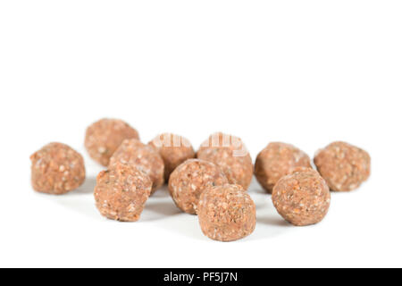Uncooked meatballs on isolated white background Stock Photo