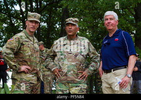 Governor Rick Snyder, Major General Gregory Vadnais, and Sergeant Major of the Army Dan Dailey look over the horizon of one of Camp Grayling, Michigan's live-fire ranges after witnessing soldiers from the 126th Infantry Regiment lay down support-by-fire as part of a training event for Distinguished Visitors Day August 15, 2018. SMA Dailey's visit and DV Day are part of exercise Northern Strike 18, a National Guard Bureau-sponsored exercise uniting service members from many states, multiple service branches and a number of coalition countries during the first three weeks of August 2018 at the C Stock Photo
