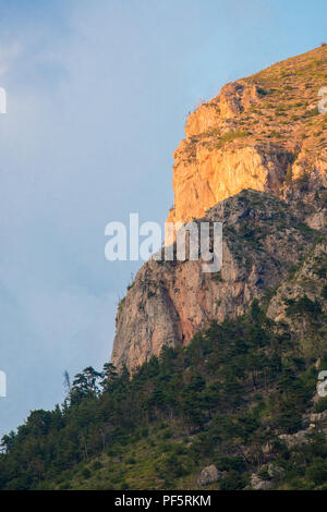 Sunset light on a cliff face in the Parc national des Ecrins, Hautes Alpes, France. Stock Photo