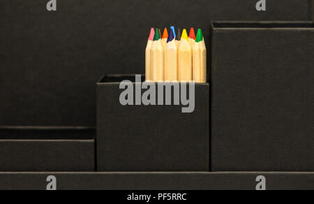 Black leather office holder with colored pencils Stock Photo
