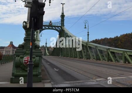 Art Nouveau style Liberty bridge, Budapest with turuls, hawk-like mythological birds on tower tops, Hungarian coat of arms in the middle + at the end Stock Photo