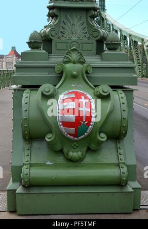 The coat of arms of Hungary designed by Virgil Nagy on lamp post ending Liberty Bridge, Budapest, designed by János Feketeházy in Art Nouveau style. Stock Photo