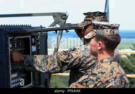 Marine Air Control Squadron employs the AN/TPS-80 Ground/Air Task Oriented Radar for air surveillance and control within the United States Marine Corps. Exercise Northern Lightning 2018 was held at Volk Field Counterland Training Center in Camp Douglas, Wisconsin. The archival image documents technical maintenance procedures performed on the TPS-80 radar during joint aviation training. Stock Photo