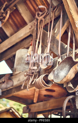 Old and oxide tools in a farm Stock Photo