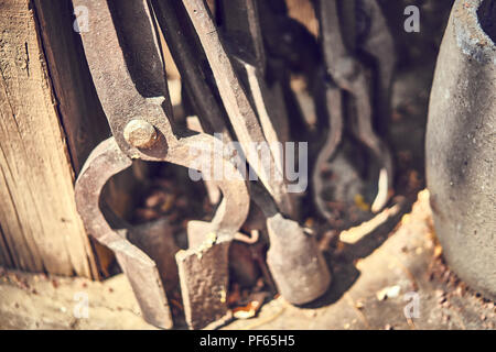 Old and oxide tools in a farm Stock Photo
