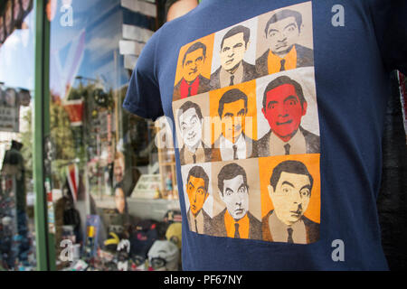 The many faces of Rowan Atkinson, aka Mr Bean, on a T-shirt on Portobello Road, London, UK Stock Photo