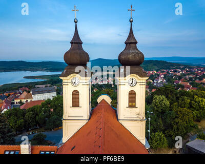 Tihany, Hungary - The two clock towers of the famous Benedictine Monastery of Tihany (Tihany Abbey) at sunrise Stock Photo