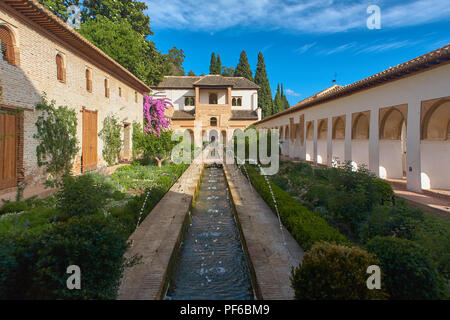 Fountains, arches and foliage inside the Generalife Gardens in the Alhambra in Granada Andalusia Spain Stock Photo