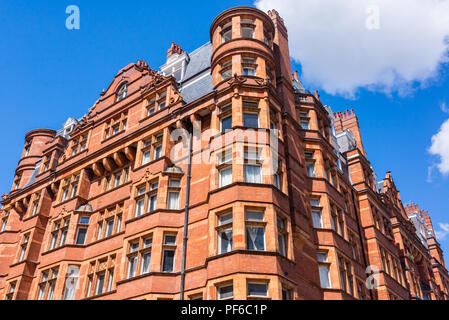 Opulent British Victorian terraced luxury residential building in red bricks in Mayfair, London, UK Stock Photo