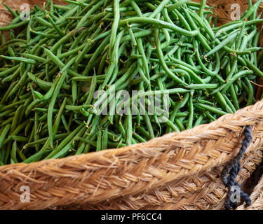 Green Beans in a Basket on a market stall in Italy Stock Photo