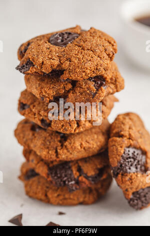Stack of healthy vegan cookies with chocolate. Clean eating concept. Stock Photo