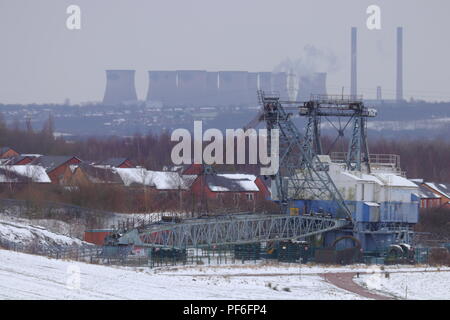 Bucyrus Erie BE1150 preserved Walking Dragline sits at the entrance to RSPB St Aidan's Nature Park wuth Ferrybridge Power Station in the background Stock Photo