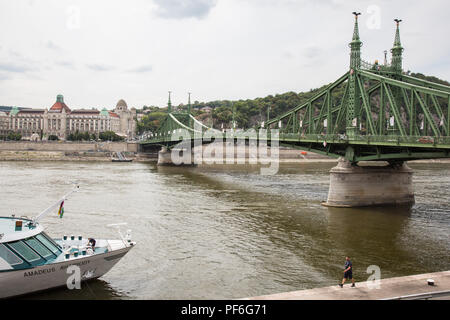 Budapest, Hungary. 15th August, 2018. A view across the Danube towards the Gellért hotel alongside the Szabadság híd (Liberty Bridge). Stock Photo