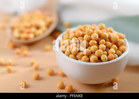 Still life with dried peas in bowl Stock Photo