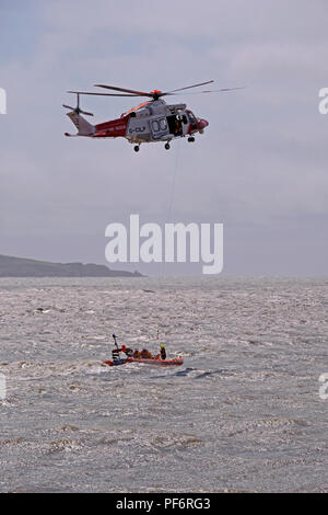 Weston-super-Mare, UK. 19th August, 2018. A lifeboat and a coastguard helicopter demonstrate rescue techniques at the annual RNLI open day. Credit: Keith Ramsey/Alamy Live News Stock Photo