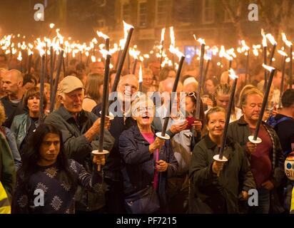 Bridport's famous Torchlight Procession makes it's way from Bucky Doo Square in the centre of town down to West Bay where the traditional fireworks and bonfire take place. It marks the end of the carnival weekend. Credit: Finnbarr Webster/Alamy Live News Stock Photo