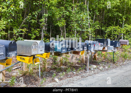 Line of mailboxes along side road Stock Photo