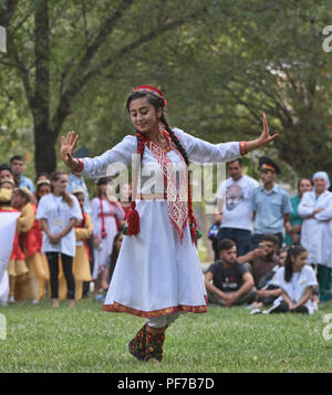 Pamiri woman dancing at the 'Roof of the World' festival in Khorog, Tajikistan Stock Photo