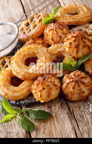 beautiful biscuit cookie rocher coco, couque and marimbas is decorated with mint close-up on the table. vertical Stock Photo
