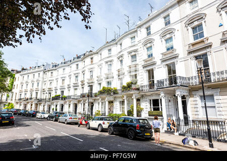 London, UK - June 24, 2018: Neighborhood district of Notting Hill, street, old vintage historic traditional style flats, white columns georgian archit Stock Photo