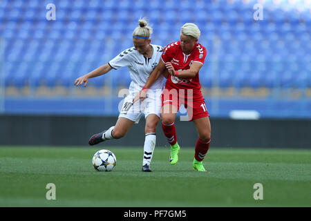 AUGUST 13, 2018 - KHARKIV, UKRAINE: Iryna Kochnyeva runs and dribbles with ball pressured by Mara Batea. UEFA Women's Champions League. WFC Kharkiv -  Stock Photo