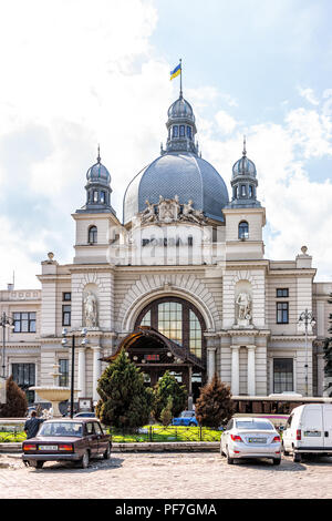 Lviv, Ukraine - August 1, 2018: Exterior facade architecture of Lvov railroad, railway, rail, train station with Vokzal sign, dome, in historic Ukrain Stock Photo