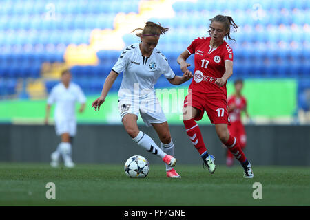 AUGUST 13, 2018 - KHARKIV, UKRAINE: Nadiia Kunina runs fast with spectacular impressive dribbling marked by Maria Neacsu. UEFA Women's Champions Leagu Stock Photo