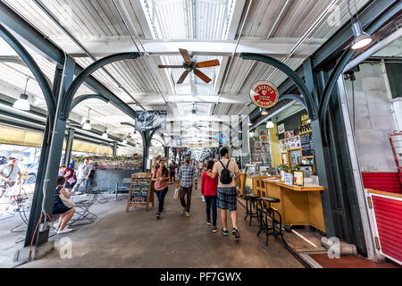 New Orleans, USA - April 23, 2018: Downtown old town French Quarter outdoor food and flea market, crafts artisan bazaar entrance, inside in Louisiana  Stock Photo