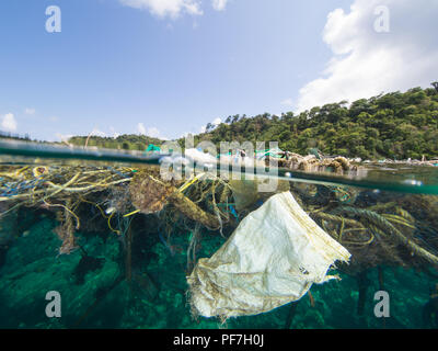 Big patch of ropes and garbage floating on the surface of the sea. Stock Photo