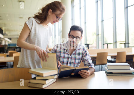 Young woman and man studying for an exam. Stock Photo