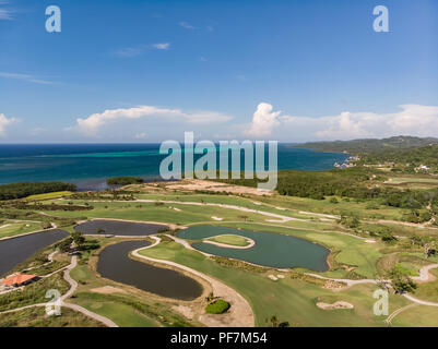 Aerial View of Tropical Golf Course with Ocean Background Stock Photo