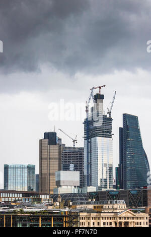 Storm clouds gathering over the changing skyline of the City of London, UK Stock Photo