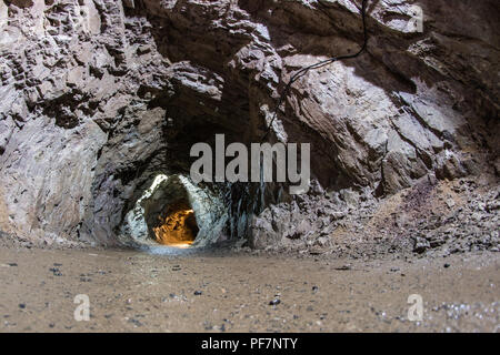 Corridor in a disused uranium mine. Old pavements carved in the rock. Season of the summer. Stock Photo