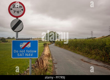 Do not follow SATNAV sign alongside a national speed limit sign in the UK Stock Photo
