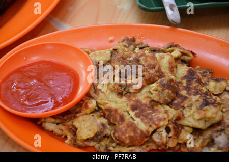 Oyster omelette is a Chinese dish that is widely known in Taiwan, Fujian, and many parts of Asia for its savory taste Stock Photo