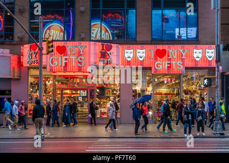 People outisde a gift shop near Times Square in New York City Stock Photo