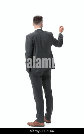 rear view.businessman writing on a virtual chalkboard Stock Photo