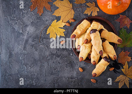 Cookies witch fingers, funny recipe for Halloween party. Top view. Flat lay Stock Photo